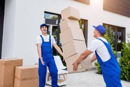 two-removal-company-workers-are-loading-boxes